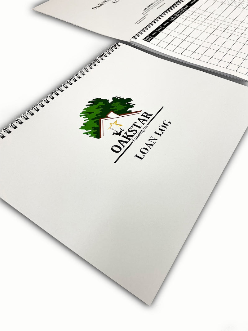 A white log book with Oakstar text on the cover.