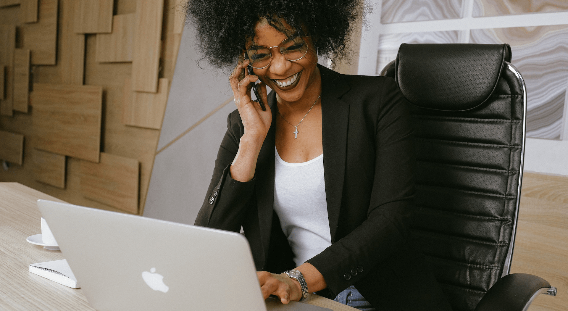 a business woman on the phone laughing