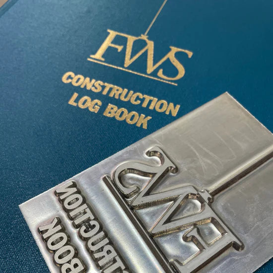 a blue log book with custom stamping