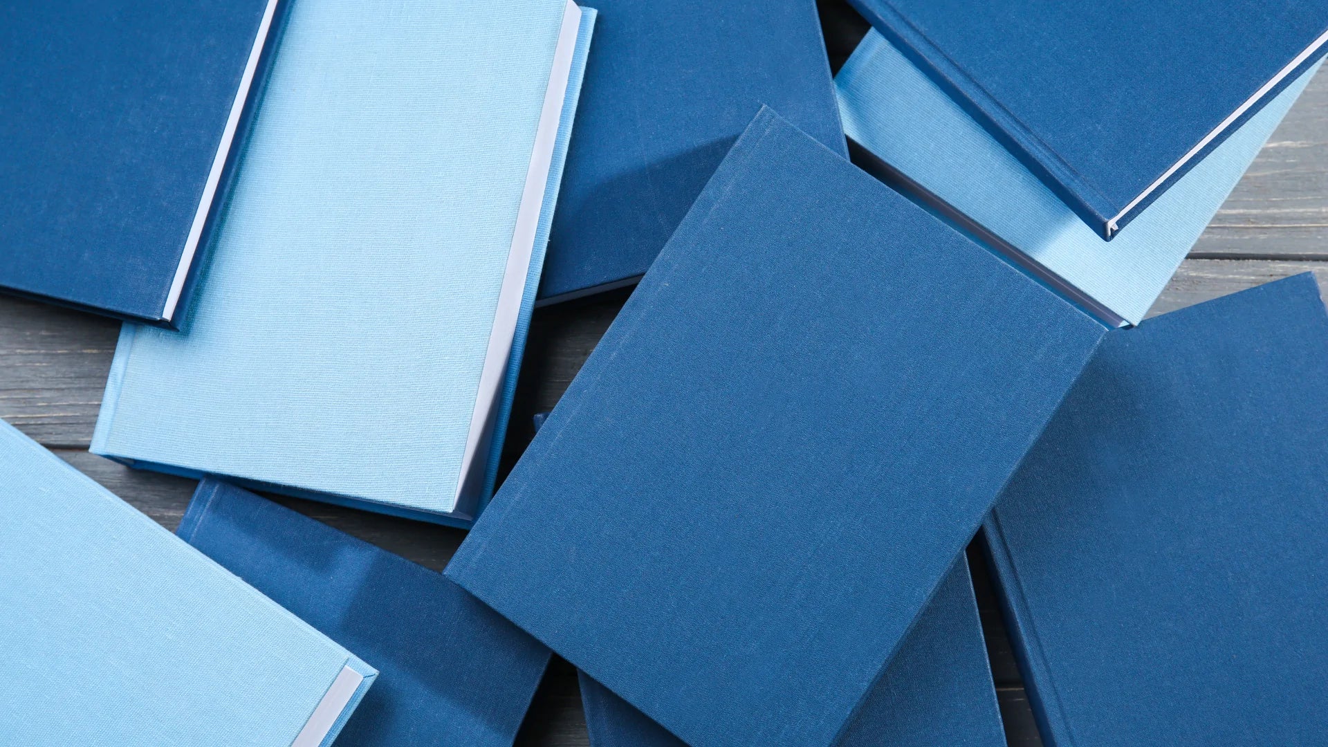 many different shades of blue log books