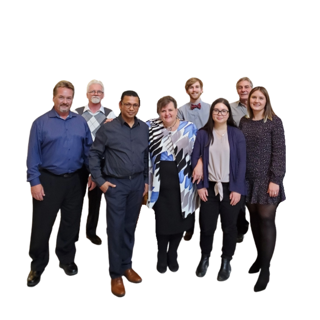 The log books team smiling looking at the camera. There are eight people in the image. 