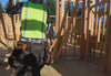Construction workers putting up framing