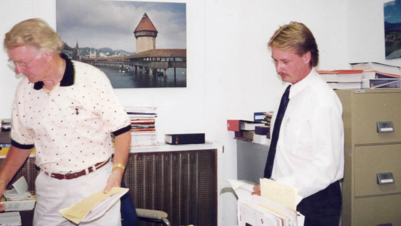 two people chatting at the Log Books office